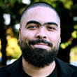 Headshot of busker Elliott Slinn