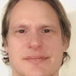 Headshot of busker Paul Neufeld