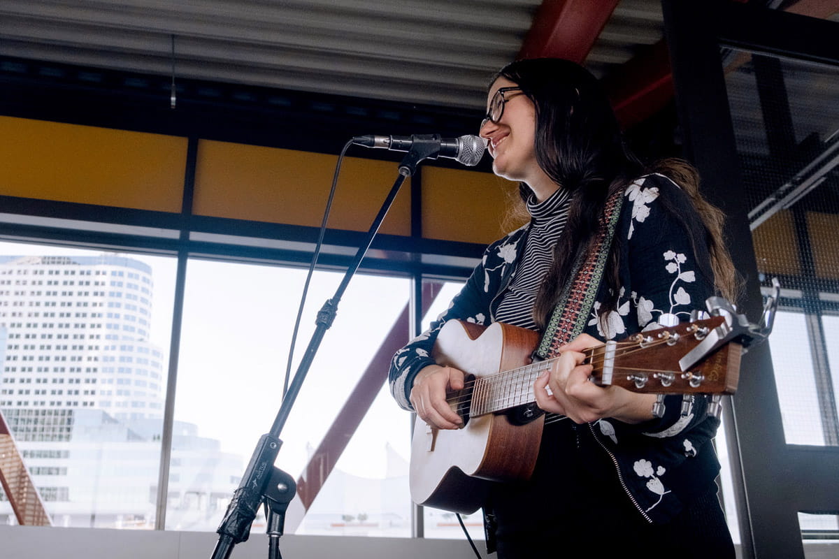 A busker performing music at the SeaBus terminal