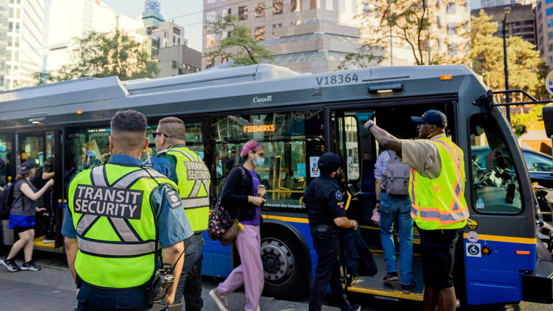 Transit Security Officers managing crowds outside of a special Fireworks bus for the Celebration of Light