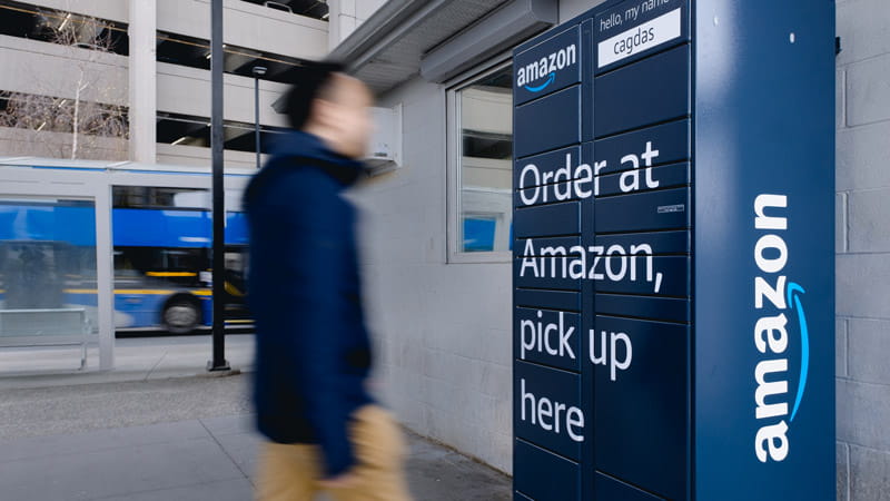 Customer approaching Amazon Delivery Lockers at Bridgeport Station