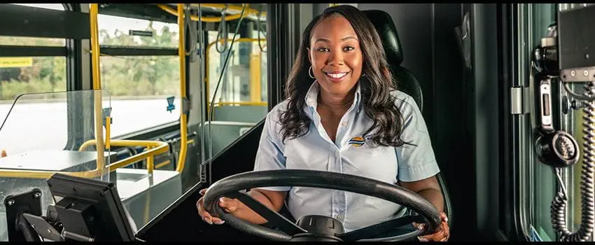 A TransLink bus driver smiling