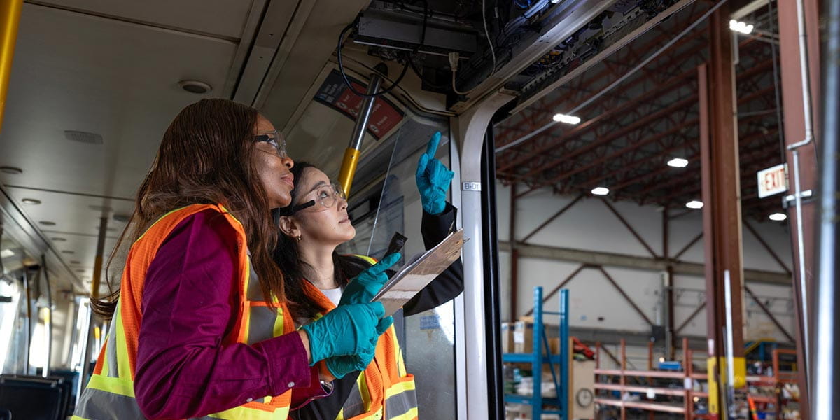 BCRTC workers inspecting rail vehicle interior