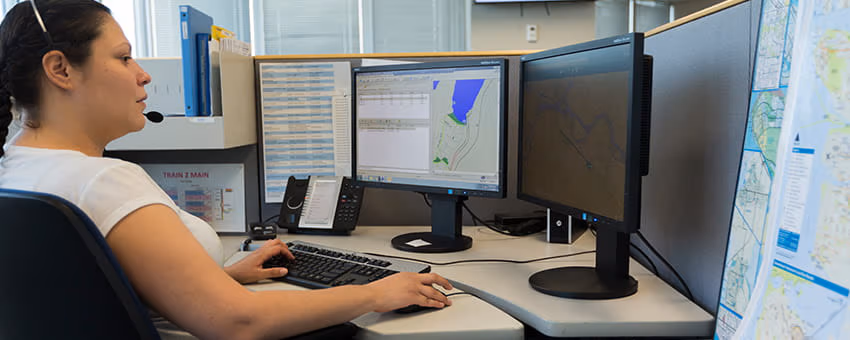 A TransLink Customer Information Agent uses a computer to provide assistance