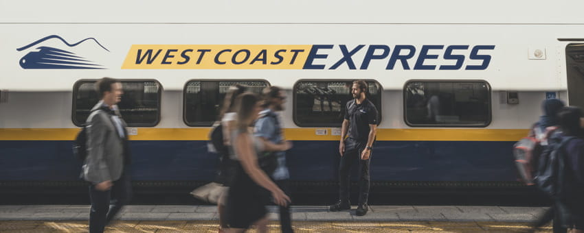 People walking by West Coast Express train