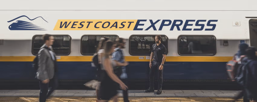 People walking by West Coast Express train