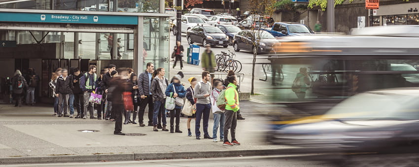Customers waiting for the 99 B-Line outside Broadway-City Hall Station