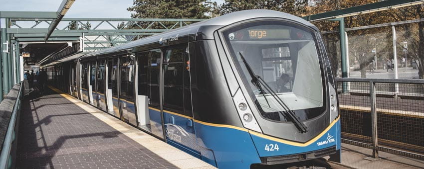 A SkyTrain approaching the station