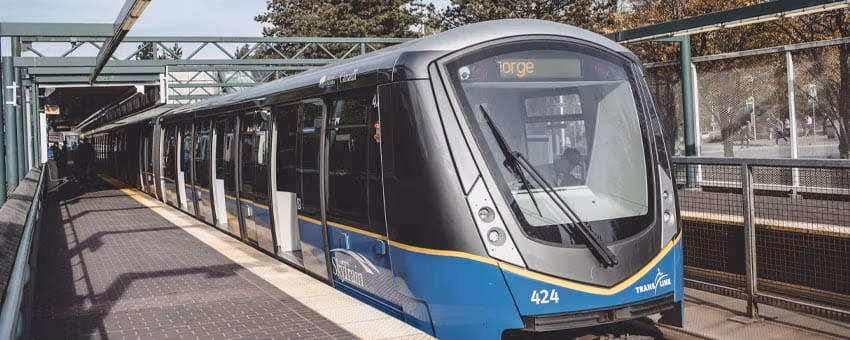A SkyTrain approaching the station