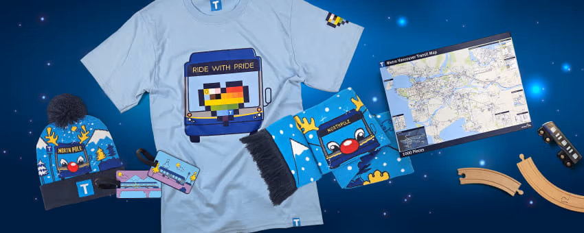 TransLink merchandise that includes Ride with Pride T-shirt, winter gear, map puzzle, and train toys.