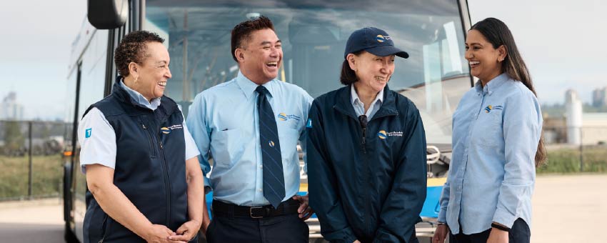Bus operators in front of a bus