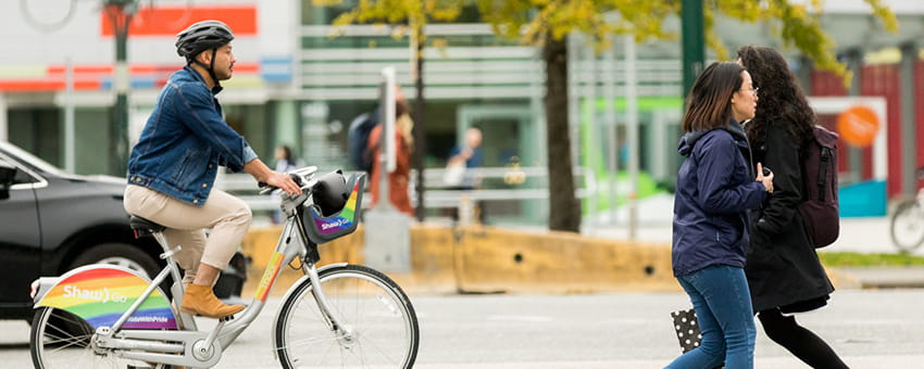 A cyclist riding a Mobi bike on a designated cycling path
