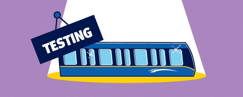Illustration of a Mark V SkyTrain with light beams shining on it and "TESTING" in bold, capitalized letters above.