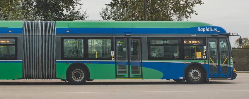 Full length shot of a green & blue RapidBus