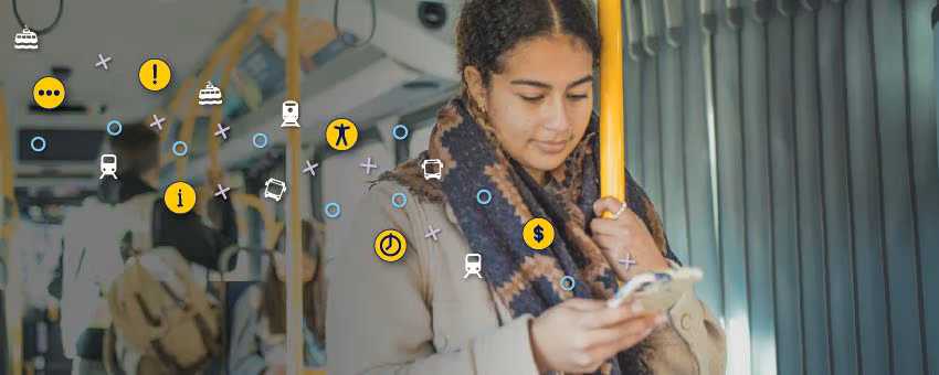 A passenger standing while commuting on the bus, looking at her phone, with yellow, teal, and white bus, SeaBus, and SkyTrain icons floating above the image.