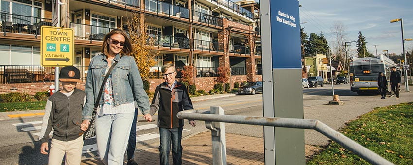 A mother waking with her two children to the Port Haney West Coast Express Station