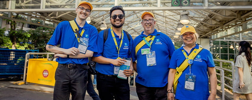 A group of TransLink community volunteers posing happily for a photo