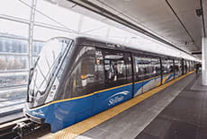 A SkyTrain stopped at a station