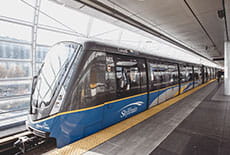 A SkyTrain docked at a station