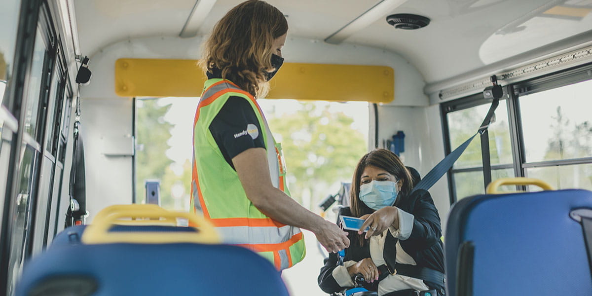 HandyDART customer getting assistance from driver