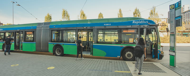A RapidBus at a bus stop picking up passengers