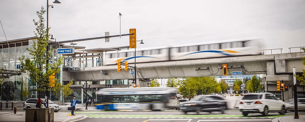 A SkyTrain leaving a station