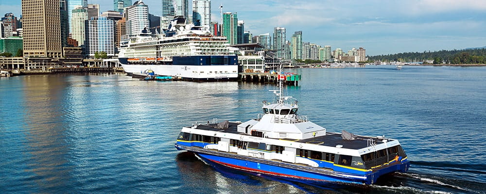 A SeaBus sailing towards downtown Vancouver
