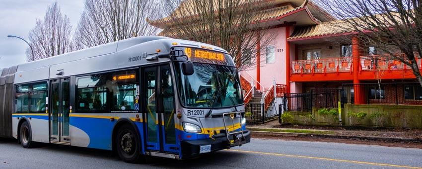 Eastbound bus along 49th avenue in front of temple