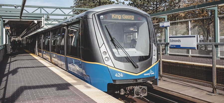 A mark four SkyTrain stopped at a station