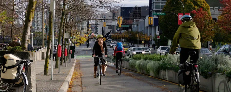 People biking in both directions in a dedicated bike lane