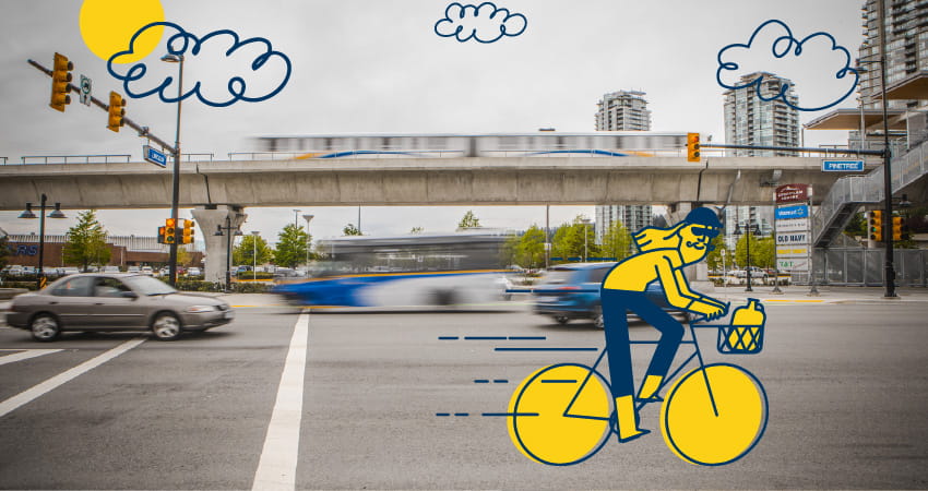 Woman carrying a bike in a SkyTrain station
