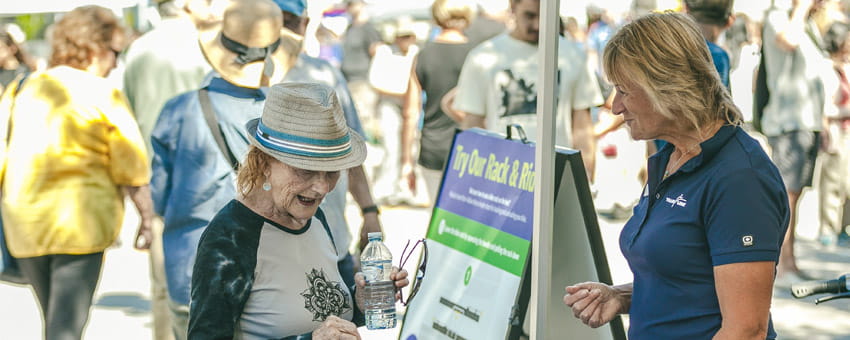 TransLink representative speaks with member of public at Car Free Day
