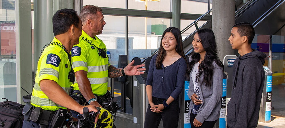 Transit Security speaking with a group of kids