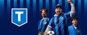 Three football fans cheering while wearing TransLink football jerseys