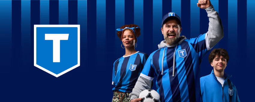 Three football fans cheering while wearing TransLink football jerseys