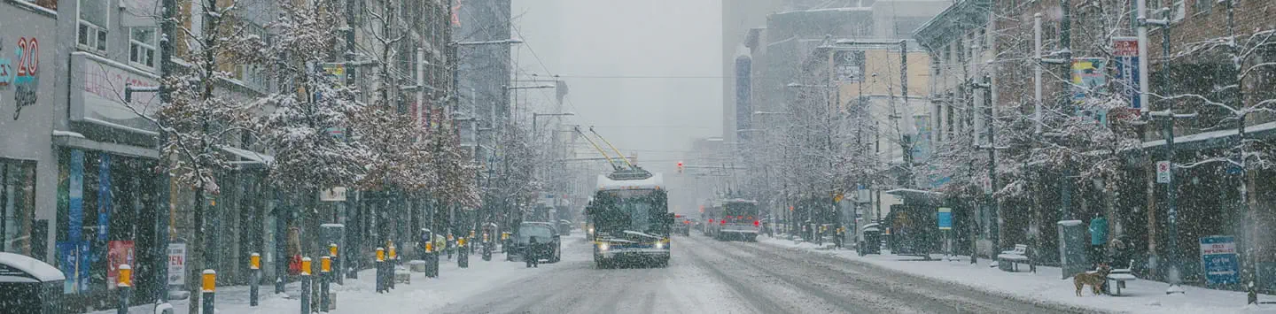 Bus heading northbound on Granville Street during heavy snow