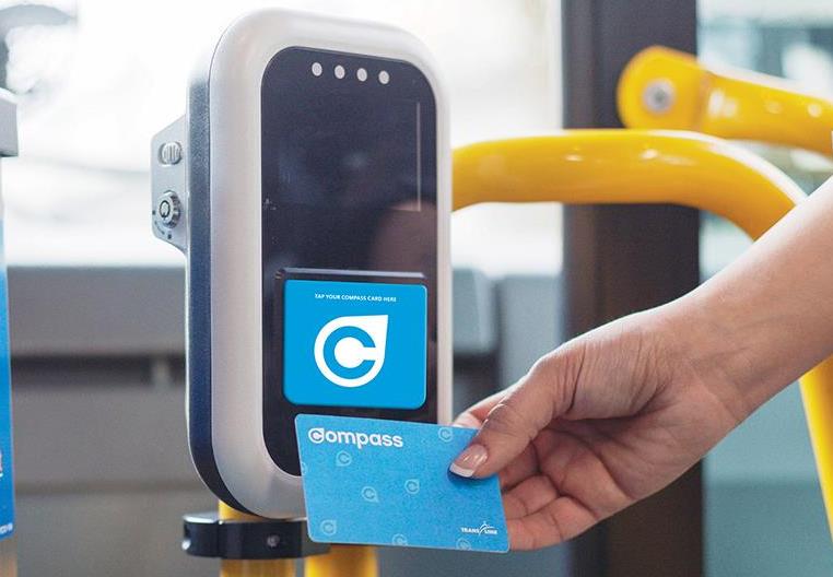 Compass Card being tapped by a card reader