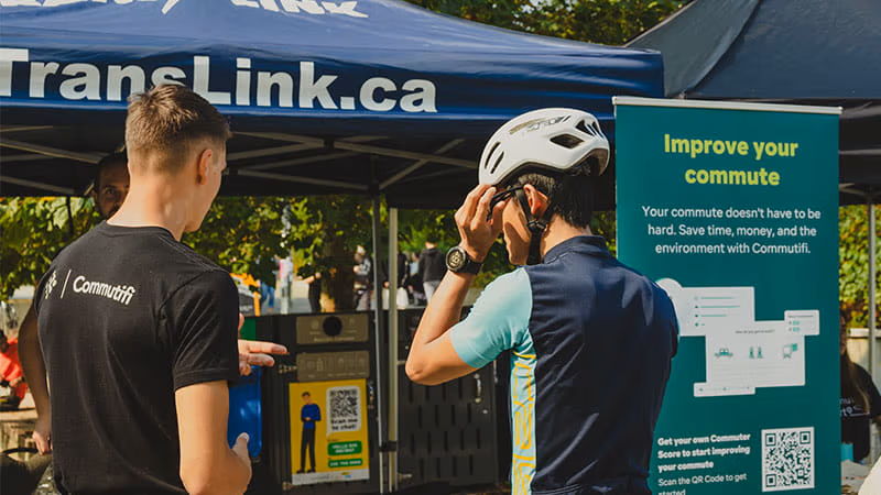 A Commutifi spokesperson talking to a cyclist about the benefits of Commutifi