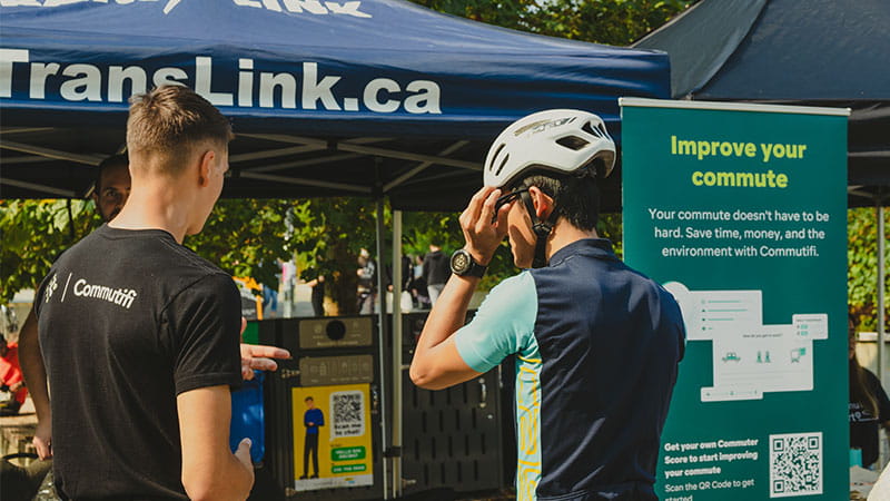 A Commutifi spokesperson talking to a cyclist about the benefits of Commutifi