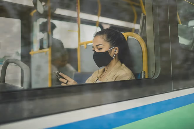 Customer uses phone on RapidBus