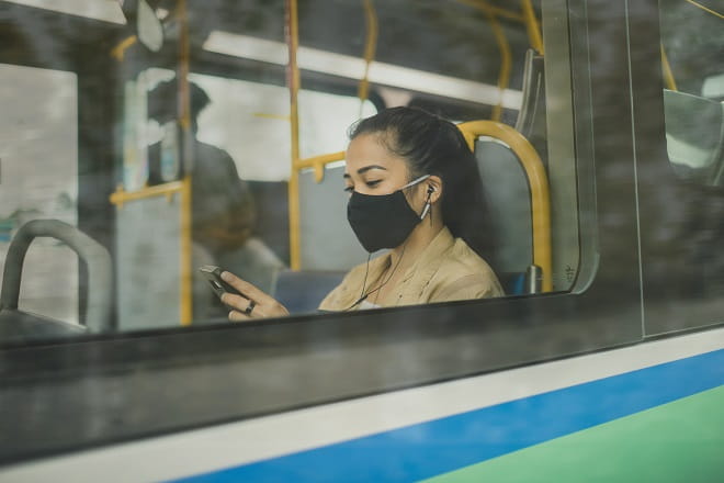 Customer uses phone on RapidBus