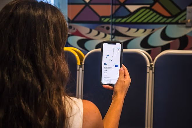 SeaBus passenger using the Transit app