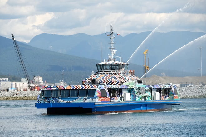 Burrard Chinook with art and water salute