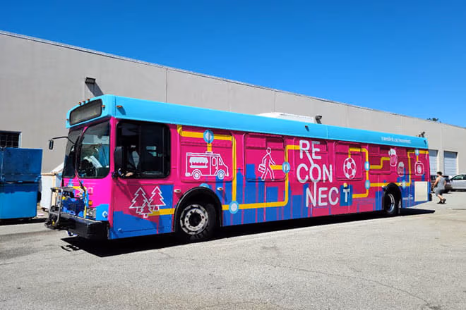 The TransLink Reconnect bus in bright pink