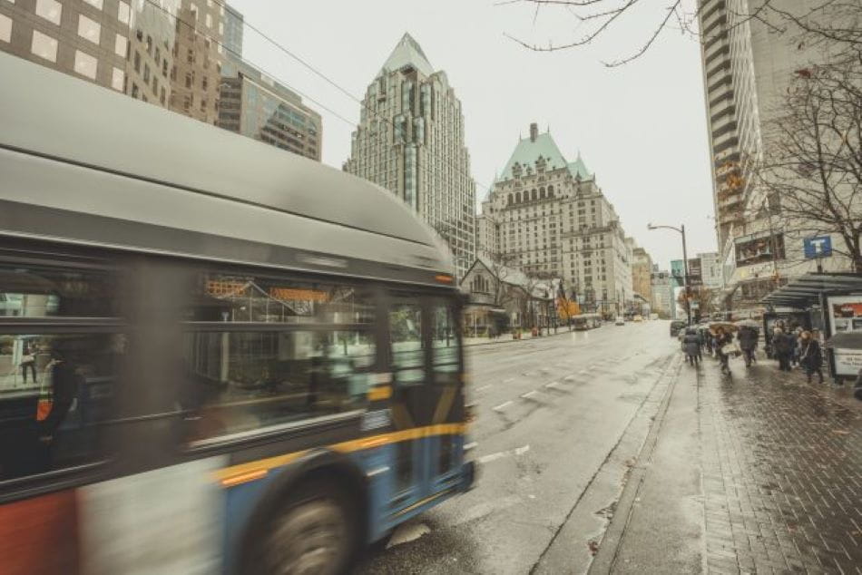 Bus approaching bus stop at Burrard Station in winter.
