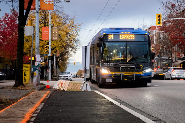 84 Express bus passing by bus bulb