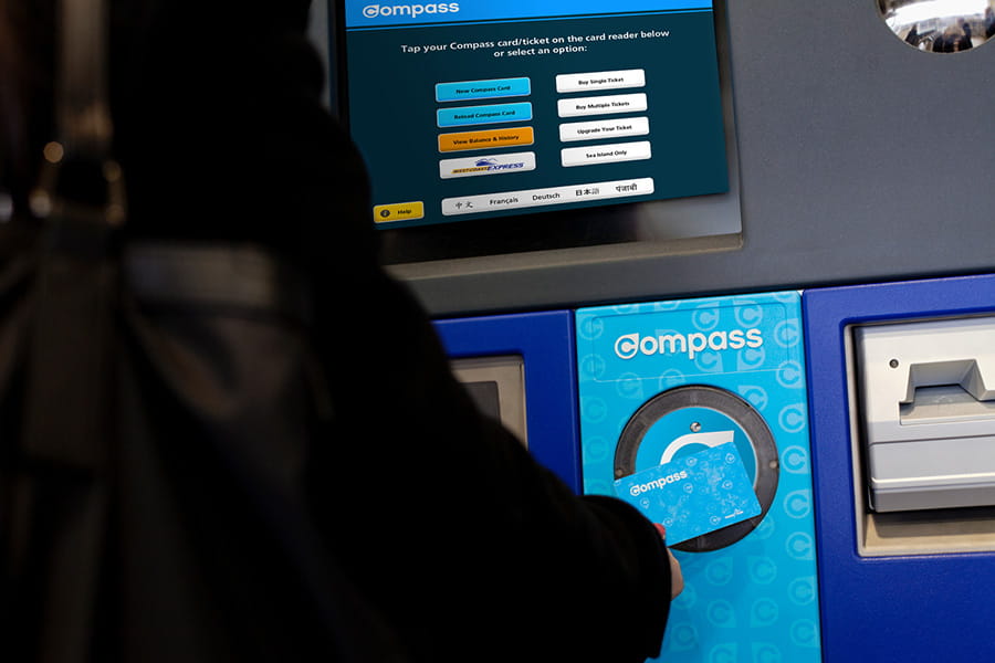 TransLink customer tapping Compass Card at Compass Vending Machine