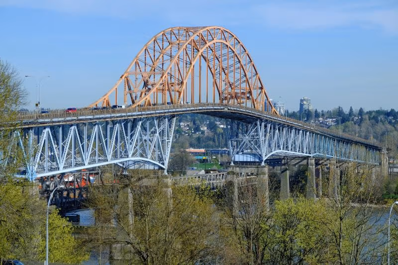 Wide shot of Pattullo Bridge on sunny day.