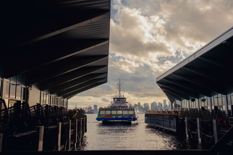 SeaBus near Lonsdale Quay with downtown Vancouver in background