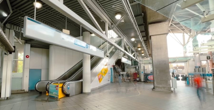 Commercial-Broadway SkyTrain Station north concourse with escalators and staircase
